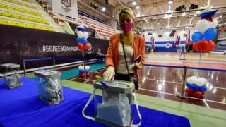 A woman votes in Vladivostok on Russia's constitutional reforms