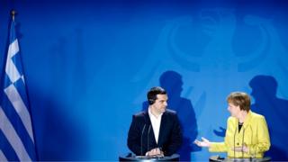 Chancellor Angela Merkel, right, and the Prime Minister of Greece Alexis Tsipras brief the media during a bilateral meeting at the chancellery in Berlin.