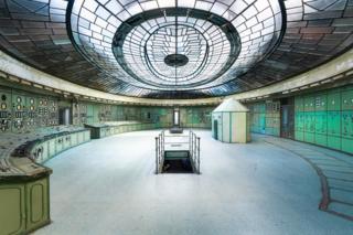 A control room in a power station with a glass-panelled ceiling
