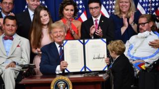 US President Donald Trump smiles after the signing of the "Right To Try Act", which allows terminally ill patients to seek treatment using drugs that have not yet been approved, at the White House in Washington, DC, on May 30, 2018. /