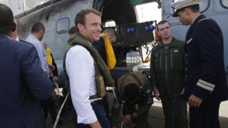 French President Emmanuel Macron comot for helicopter wey bring am