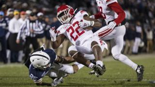 A match between American football college teams Rutgers Scarlet Knights (players in white and red) and Penn State Nittany Lions. Photo: November 2019