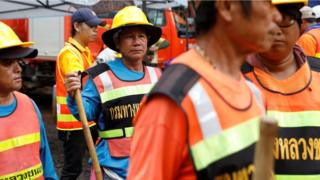 Rescue personnel work at Tham Luang cave complex