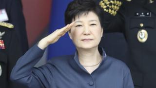 South Korean President Park Geun-Hye salutes during a ceremony on the country's armed forces day, October 1, 2016