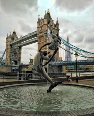 Girl with a Dolphin statue by Tower Bridge