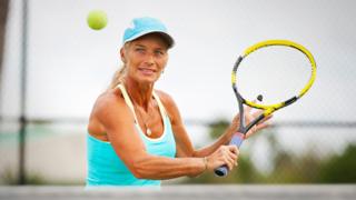 Woman playing tennis