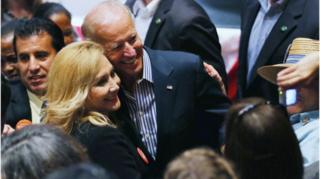 Joe Biden poses with a female supporter on the campaign trail in 2012