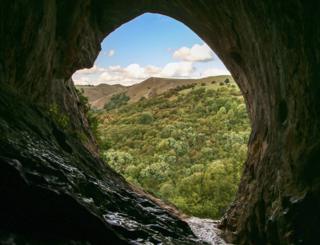 Landscape view from inside a cave