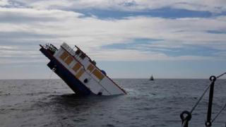 A Mississippi-style paddle steamer sinking into the Irish Sea