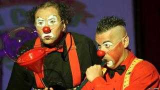 Clowns perform at El Circo de la Chola Chabuca, Sunday, July 19, 2009, in Lima, Peru