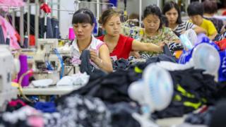 This photo taken on August 2, 2018 shows workers at a swimwear factory in Yinglin town in Jinjiang, in China's eastern Fujian Province
