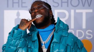 Nigerian singer-songwriter Burna Boy poses on the red carpet on arrival for the BRIT Awards 2020 in London on 18 February 2020.