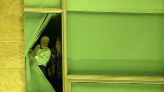 Dilma Rousseff (right) and chief of staff Jaques Wagner stand at a window at Planalto Palace in Brasilia, Brazil
