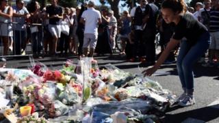 Flowers marking the death of 84 people in Nice