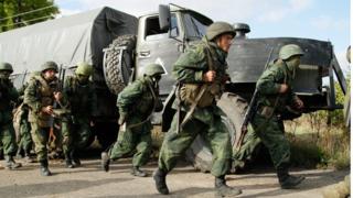 Pro-Russian separatists troops (forces, soldiers) leave their position during withdrawal in the village of Petrovske, some 50 km from Donetsk, on October 3, 2016. Ukraine"s army and pro-Russian separatists both announced on October 1 the pull back of their troops from a small eastern city as agreed in a demilitarisation accord signed last month. EPA/ALEXANDER ERMOCHENKO