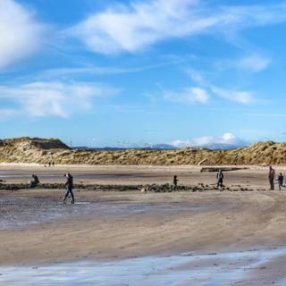 Beadnell Bay on the Northumberland Coast, with the snow dusted Cheviot Hills in the background
