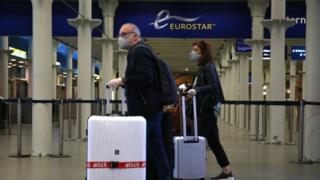 Passengers wearing facemasks at the Eurostar terminal at St Pancras station in London