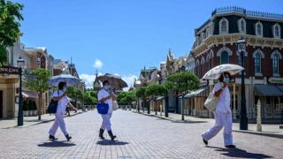 Workers at Disneyland in Hong Kong