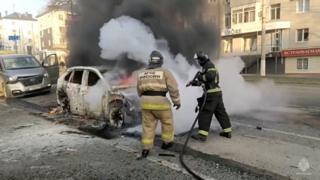 Firefighters extinguish a burning car in Belgorod