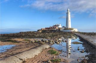 St Mary's Lighthouse reflected in water