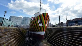 A picture shows the newly-painted Edmund Gardner, a historic pilot ship placed in the dry dock at the Albert Dock in Liverpool, northwest England on June 11, 2014.