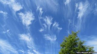 Wispy clouds in a blue sky