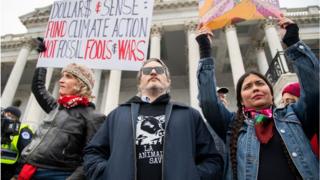 Tara Houska (right) protesting in Washington DC alongside actor Joaquin Phoenix