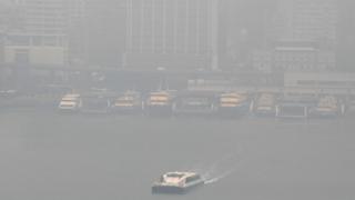 Sydney harbour ferries in the dock amid thick smoke