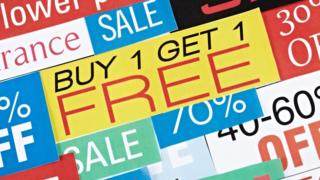 Signs for buy-one-get-one-free and other deals