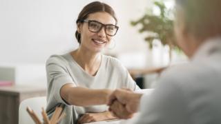 Smiling woman at a job interview