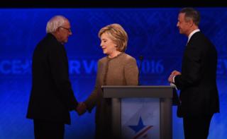 US Democratic presidential hopefuls (L-R) Bernie Sanders, Hillary Clinton and Martin O"Malley greet each other