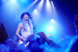 Band performing on stage at music concert - stock photo