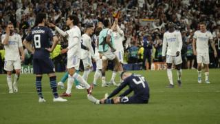 Real Madrid players celebrate in front of Phil Foden and Ilkay Gundogan