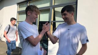 Two boys celebrating exam results in Jersey