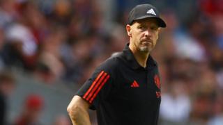 Erik ten Hag stands on the touchline