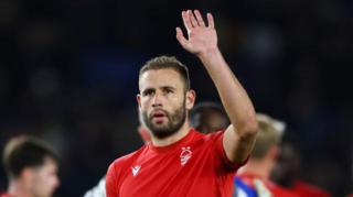 Steve Cook acknowledges Forest fans after a match