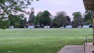 Travellers on school field