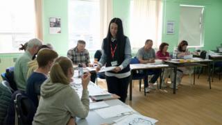 Tutor teaching Ukrainian refugees in Brighton