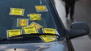 Parking tickets on a windscreen