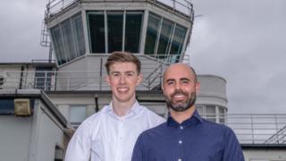 Ben Harrety in front of Teesside Airport control tower 