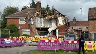 Homes, including one house with its roof blown off, is cordoned off in Middlesbrough after an explosion.