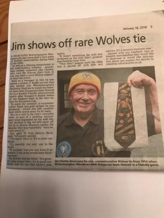 Jim shows his tie in local paper