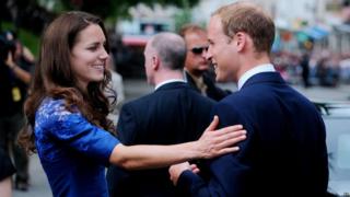 Prince William and Kate, the Duke and Duchess of Cambridge, talk during a ceremony at Quebec City Hall