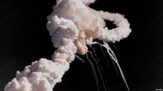 Clouds of smoke as space shuttle Challenger is destroyed soon after launching