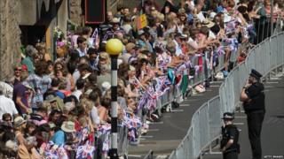 A huge crowd lining the streets to support royal couple