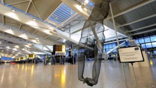 Life-size wire sculpture of diver Tom Daley at Heathrow Airport