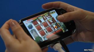 A person testing the PlayStation Vita.