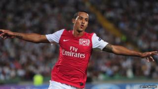 Arsenal player Theo Walcott celebrates scoring against Udinese in the Champions League