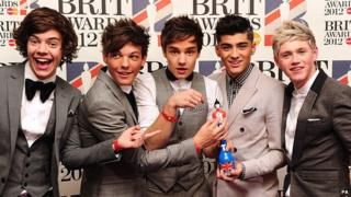 One Direction plan to keep their Brit Award in the toilet.