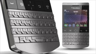A BlackBerry smartphone in silver. It has raised metal buttons.